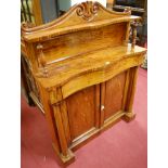 A Regency flame mahogany serpentine front double door chiffonier, having raised superstructure,