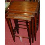 A 1930s oak nest of three occasional tables, the largest w.