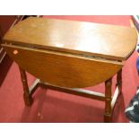 A small oak dropflap occasional table