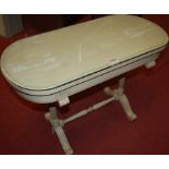 A cream painted low occasional table in the French taste