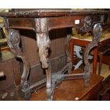 A 19th century Continental low relief carved walnut fold-over card table,