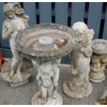 A reconstituted stoneware cherub bird bath, cherub figure,