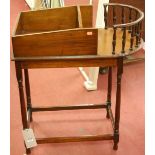 An early 20th century walnut portable drinks table