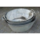 Three graduated zinc twin handled baths