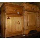 A modern pine single door bedside cupboard,