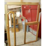 A large reproduction gilt framed and bevelled wall mirror,