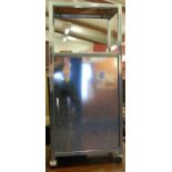 A contemporary steel single door medicine cabinet,