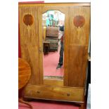 An Edwardian walnut and satinwood inlaid single mirror door wardrobe,