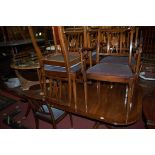 A good quality contemporary mahogany and crossbanded twin pillar round cornered dining table,