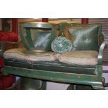 An early 20th century green chinoiserie lacquered bergère suite, comprising three seater sofa,