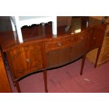 A reproduction mahogany Regency style serpentine front sideboard, w.