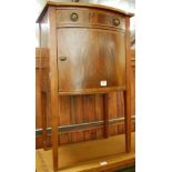 An Edwardian oak, mahogany and satinwood cross banded bowfront single door bedside cupboard,