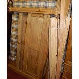 A modern pine double bedstead, having side-rails,