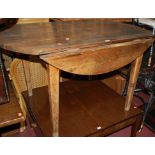 A 19th century provincial French pine plank-top dropflap kitchen table, w.