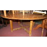 A large contemporary pitched pine circular dining table, dia.