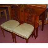 A mahogany dropleaf dining table;