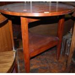 A provincial joined elm circular topped cricket table, having triangular platform undertier, dia.