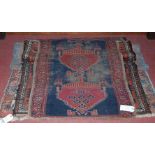 Three various small Persian woollen rugs