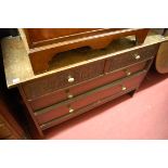 An early 20th century low relief, carved and moulded oak mirror back dressing chest,