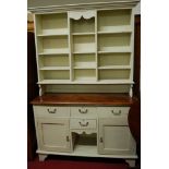 A Victorian style cream painted pine kitchen dresser,