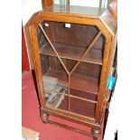 An Art Deco oak single door glazed bookcase, w.