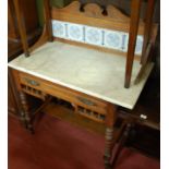 An Edwardian walnut white variegated marble topped and tile inset single drawer washstand, w.