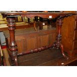 A late Victorian mahogany hall table, the top of shaped form,
