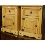 A pair of contemporary pine and metal bound single door bedside cupboards,
