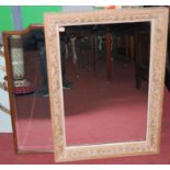 A circa 1900 French low relief floral carved pine rectangular wall mirror;