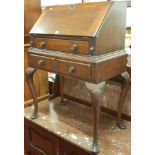 An early 20th century mahogany ladies slopefront writing bureau,