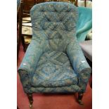 A 19th century simulated rosewood framed and geometric floral upholstered buttonback tub armchair