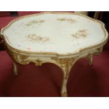 A French style white painted and gilt decorated shaped top low occasional table