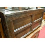 A provincial early 18th century joined and panelled oak hinge-top coffer, w.