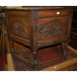 A joined and low relief carved oak single door credence cupboard