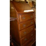 A reproduction burr walnut and crossbanded slopefront four drawer writing bureau,