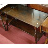 An Edwardian walnut two-tier occasional table