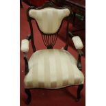 An Edwardian mahogany three piece salon suite, comprising two seater sofa,