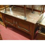 An Edwardian walnut and variegated marble mirror back washstand,