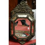 A 19th century Continental floral embossed metal and bevelled wall mirror,