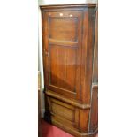 A 19th century oak two-door freestanding corner cupboard