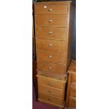 A contemporary light oak six drawer narrow chest;