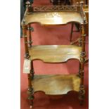 A figured walnut and floral satinwood inlaid three tier whatnot,