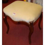 A 19th century French walnut framed and upholstered dressing stool, of shaped form,