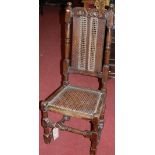 An antique joined walnut and cane inset single highback dining chair
