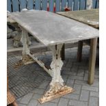 A Victorian cast iron table base with probably associated weathered white marble top, width 148cm,