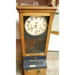 An International Time Recording Company Ltd of London oak cased clocking-in clock