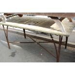 A 19th century marble on wrought metal garden table,