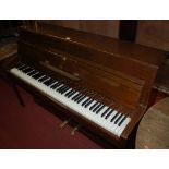 A 1970s upright piano by Wenn,