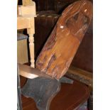 An African hardwood low relief carved X-framed side chair,