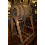 An early 20th century coopered oak ***butter churn*** on stand,